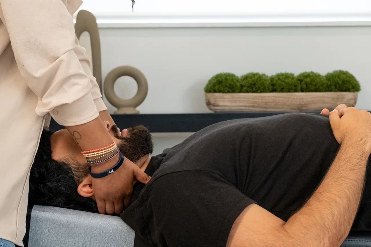 Adult receiving chiropractic care