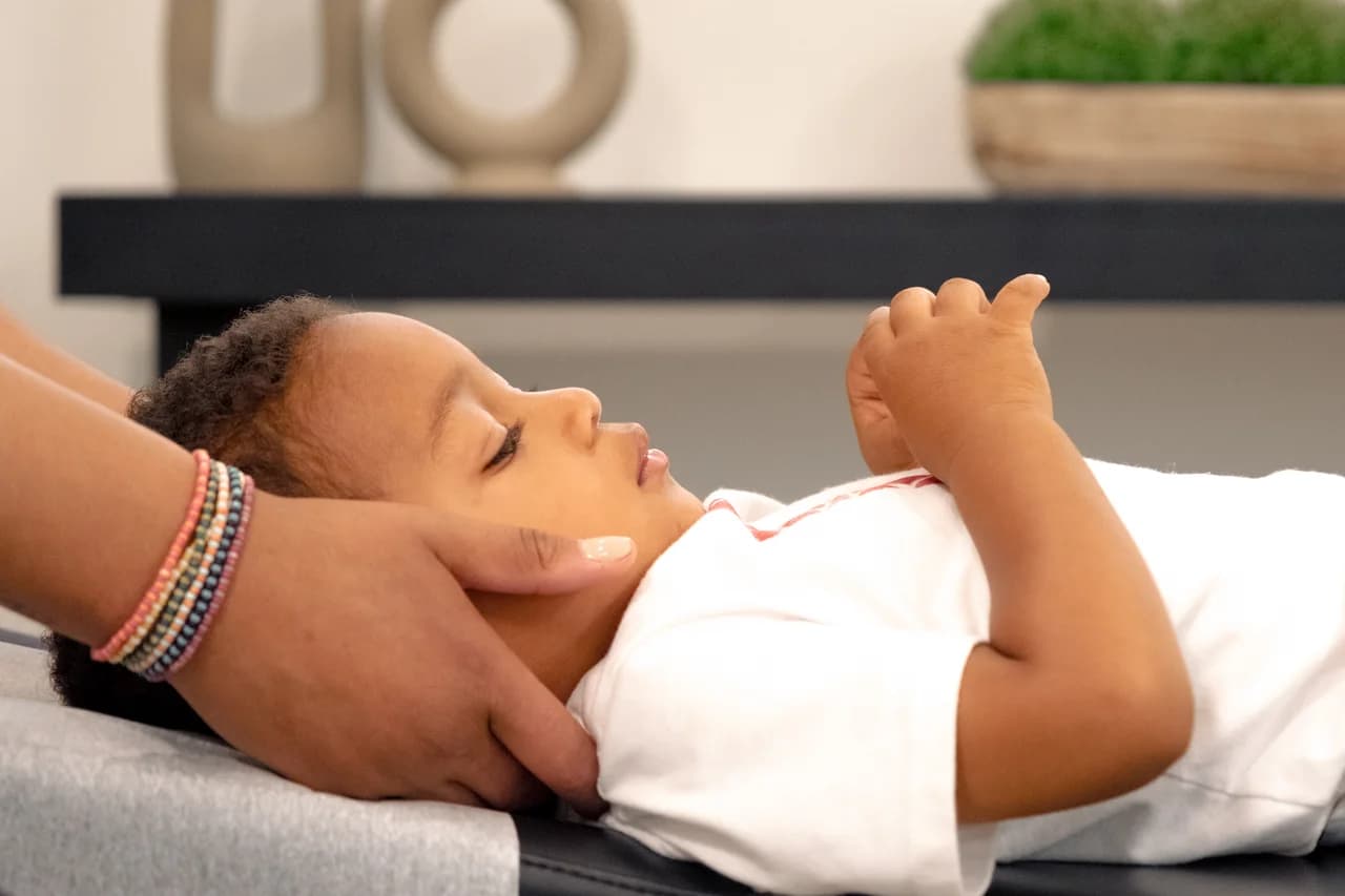 Child receiving chiropractic adjustment