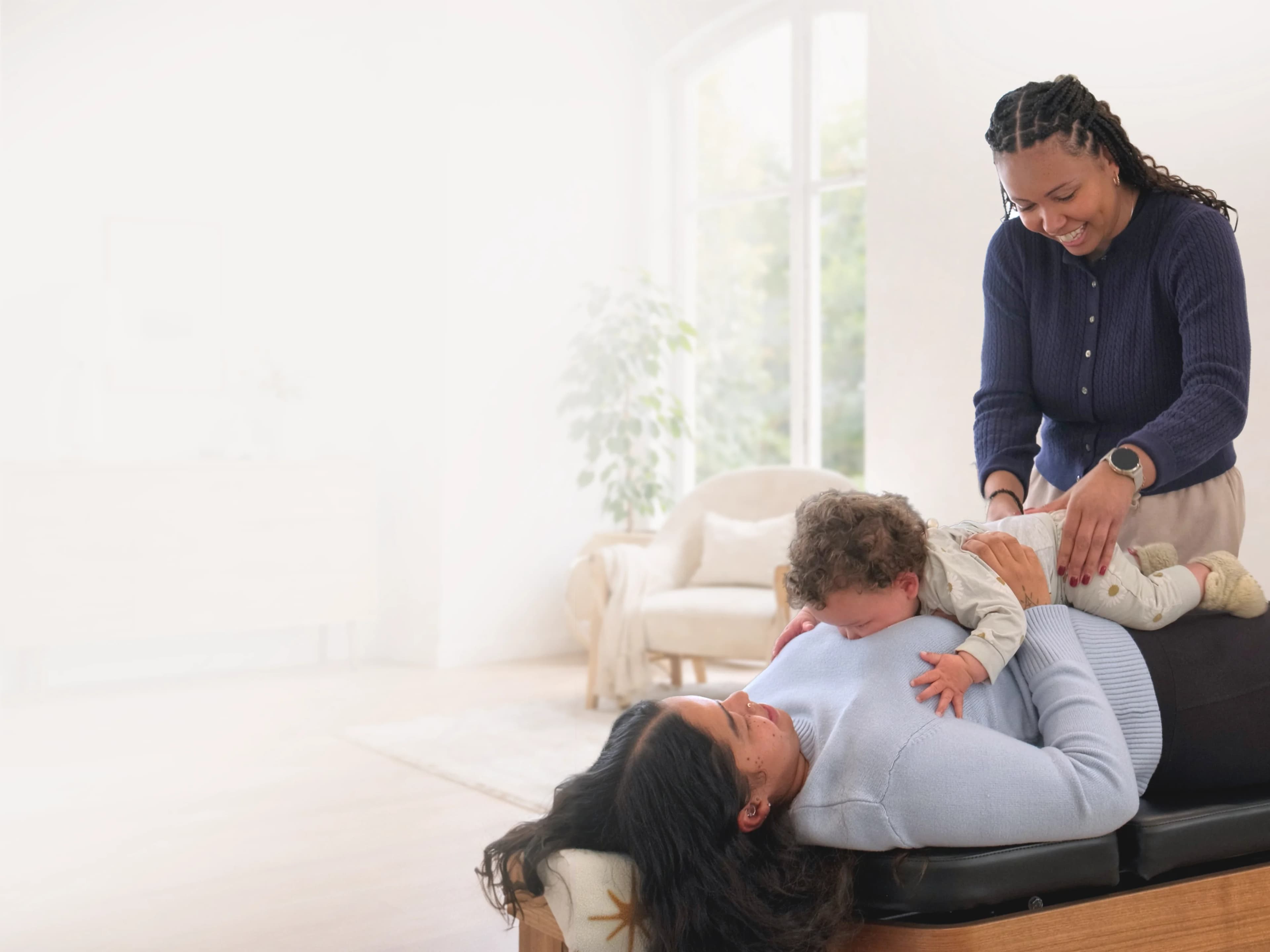 Baby receiving gentle chiropractic care at Fika in Oakland